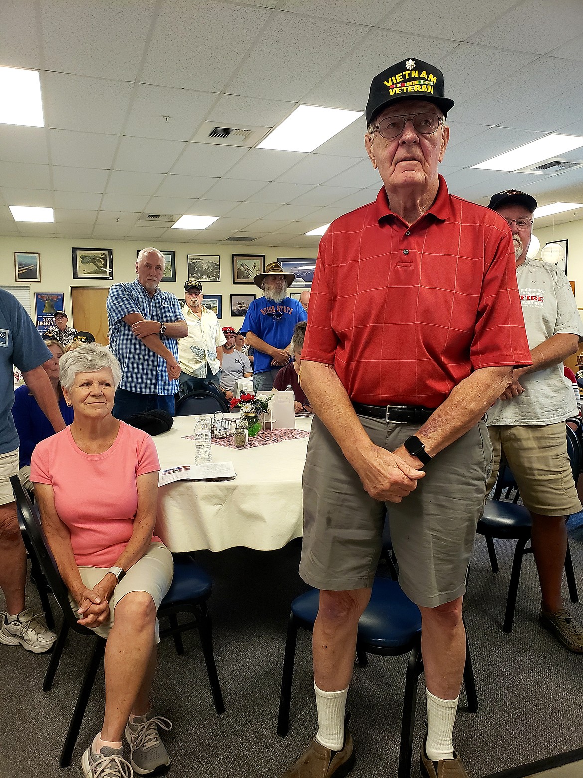 Carl Gidlund stands to receive applause for his service in the Vietnam War as his wife, Sally Gidlund, proudly looks on at a Vietnam Welcome Home ceremony Saturday in Post Falls.