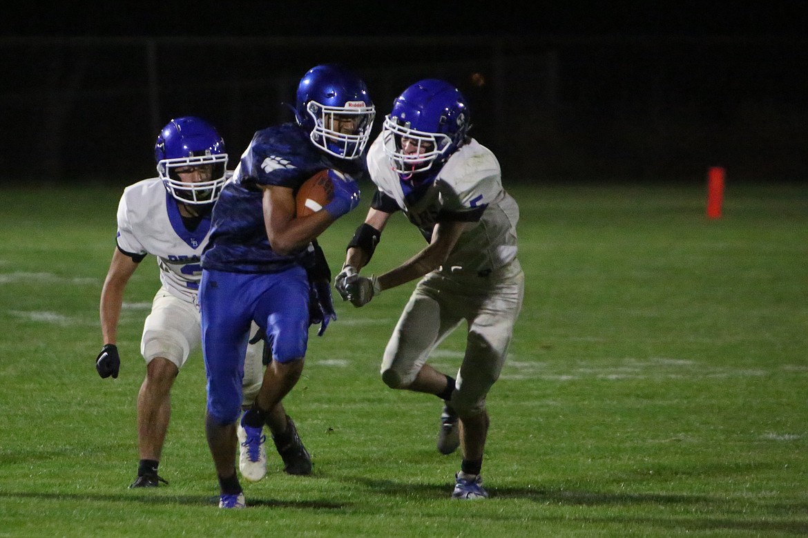 Warden senior Angel Lino Segoviano, in blue, caught seven passes for 115 yards and a touchdown in Friday’s loss to Kiona-Benton.