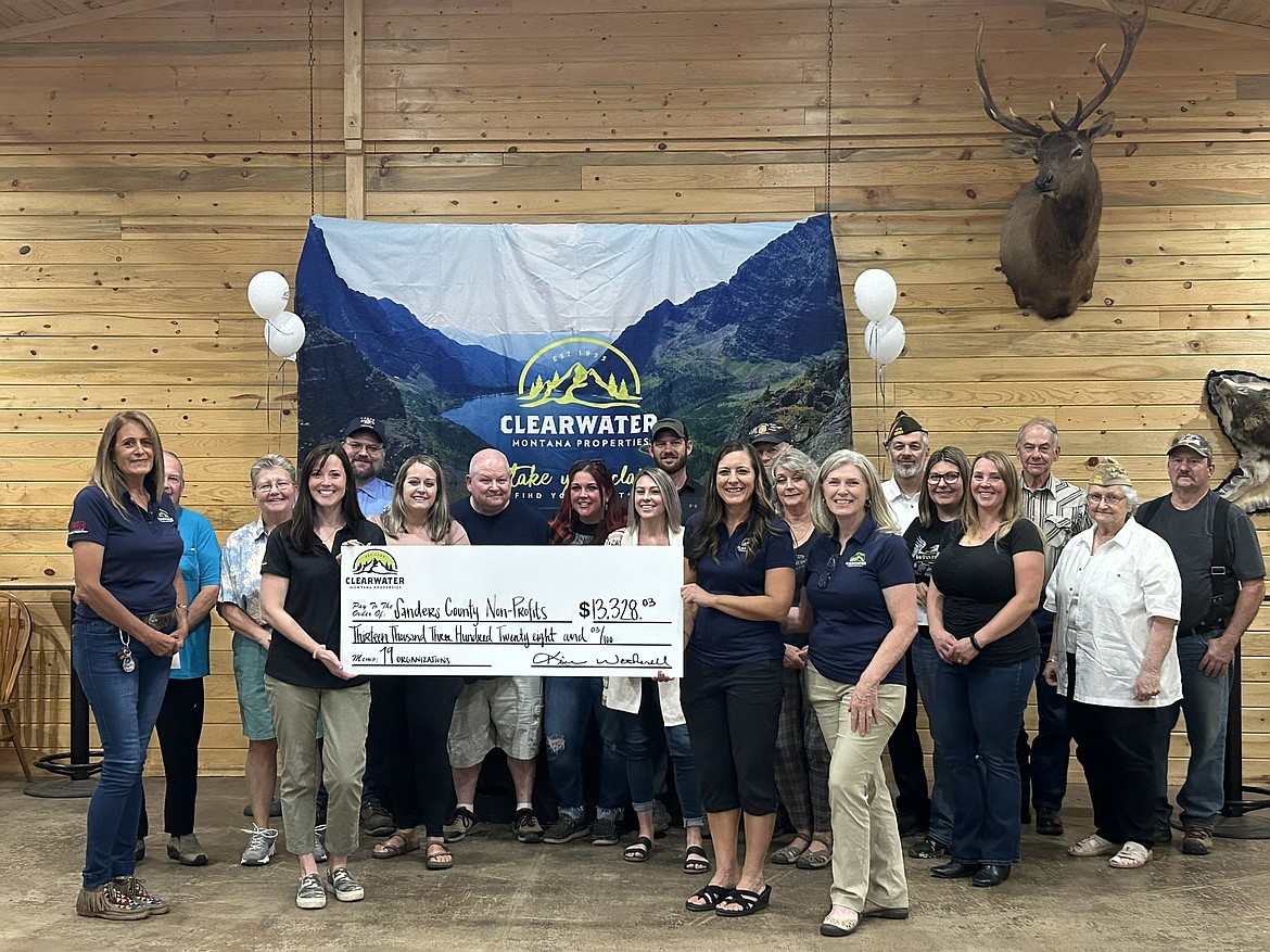 Recipients and agents from Clearwater Montana Properties at a recent donation presentation event. (Photo by Clearwater Montana Properties)