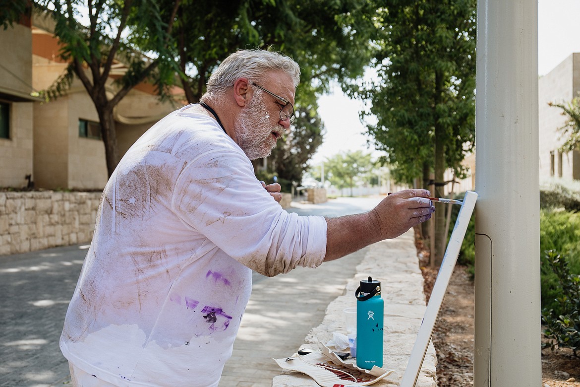 Sanders County artist David Williams paints in Israel. (Abigail Maki photo)