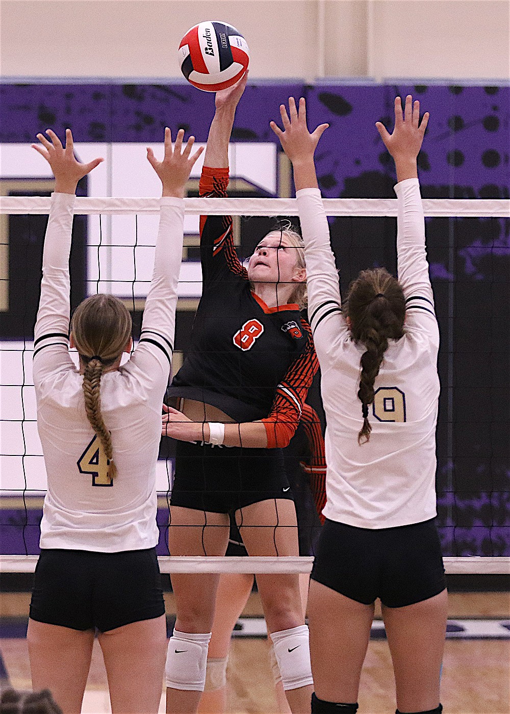 Maiden Lauryn Burr makes the kill during Saturday's game against the Lady Pirates. (Bob Gunderson photo)