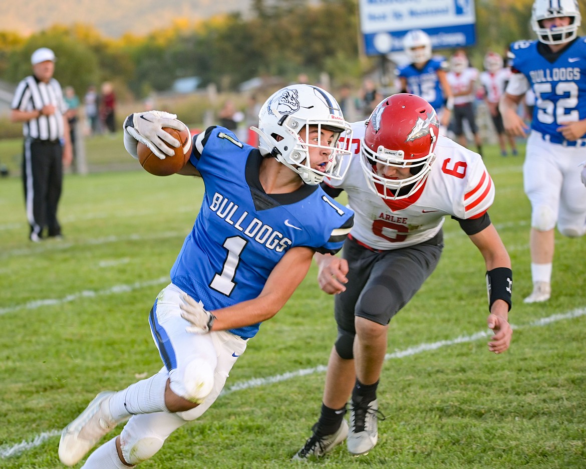 Arlee's Talyn Belcourt tries to catch Mission's Iyezk Umphrey in Friday's contest between the Lake County rivals. (Christa Umphrey photo)