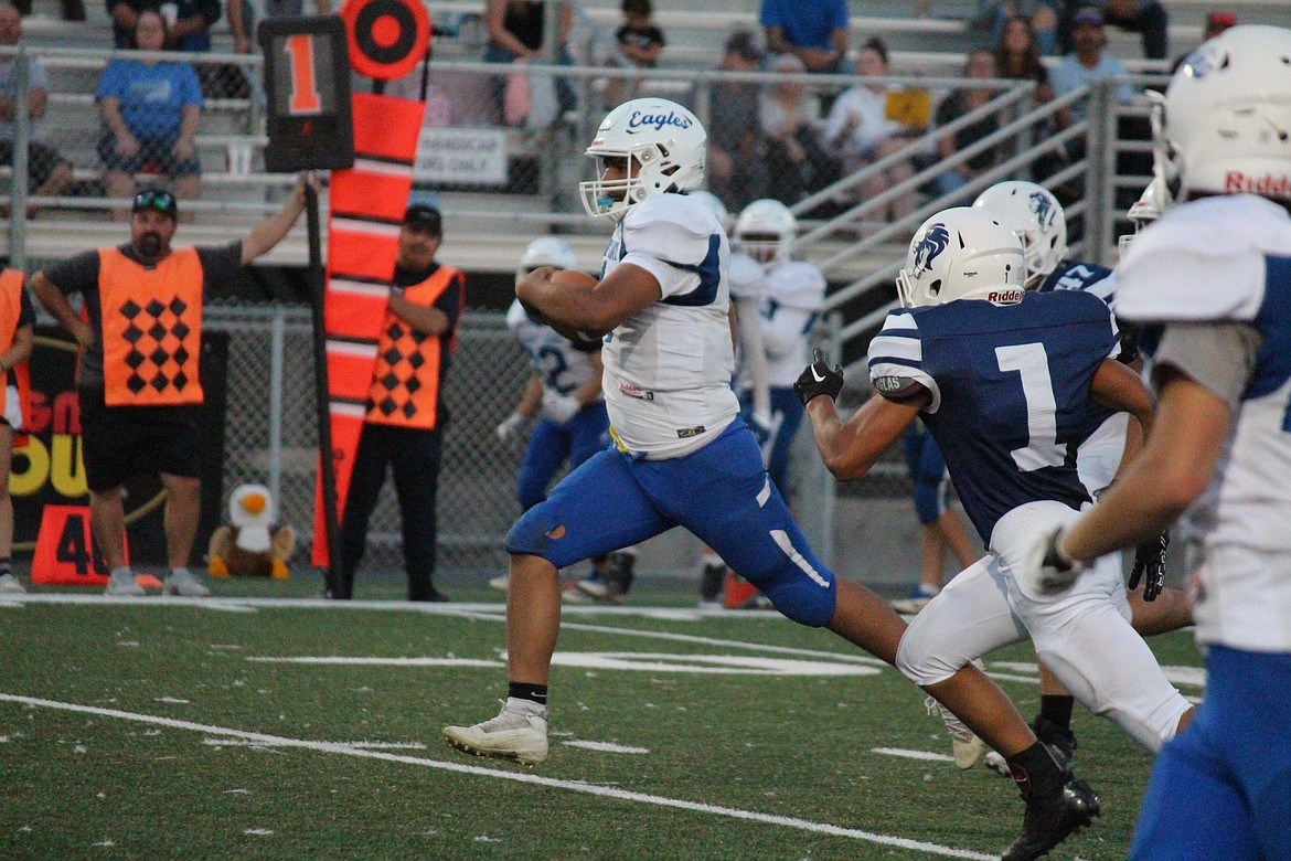 Soap Lake quarterback Jairo Lopez (4) heads downfield during Saturday’s game.