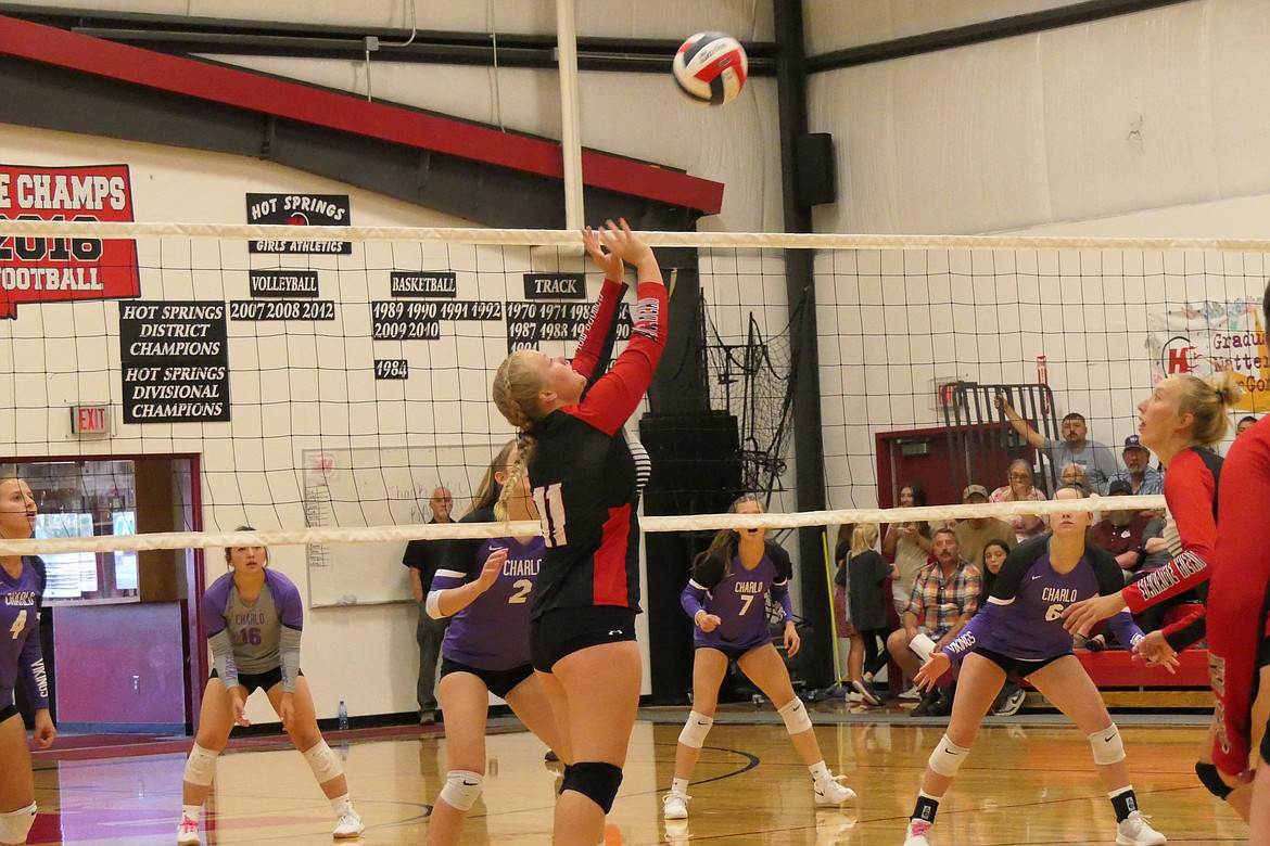 Hot Springs junior Georgia Uski goes for a set against Charlo during their match Saturday evening in Hot Springs. (Chuck Bandel/VP-MI)