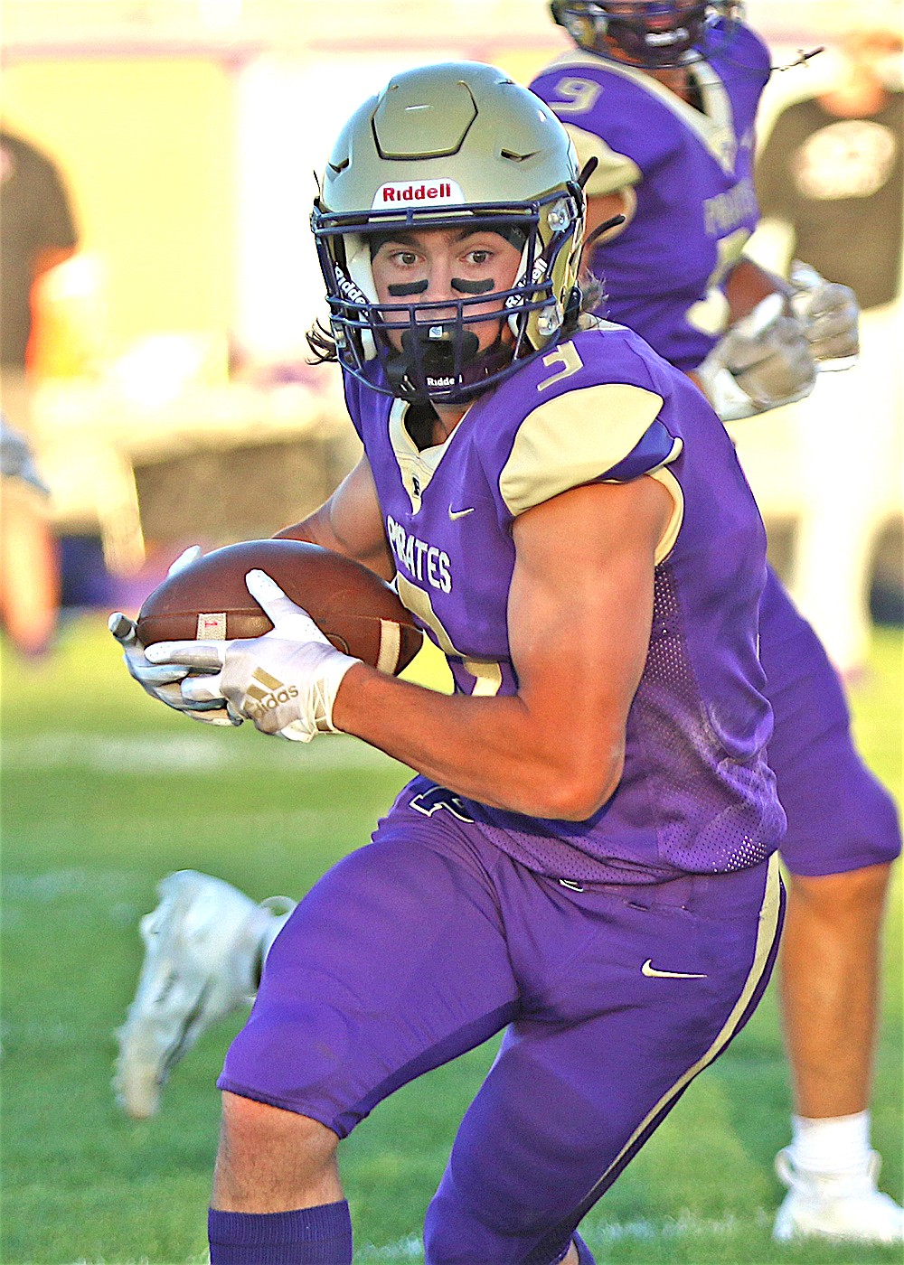 Polson wide receiver Tommy Sherry runs after a pass interception Friday night. (Bob Gunderson photo)