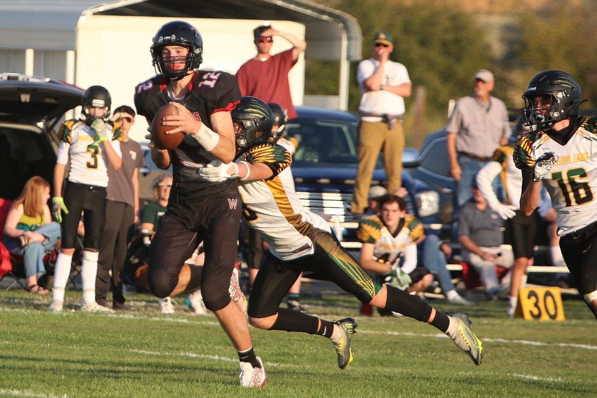 ACH freshman Max Grindy (12) hauls in a 62-yard pass, where he broke a tackle and scored.