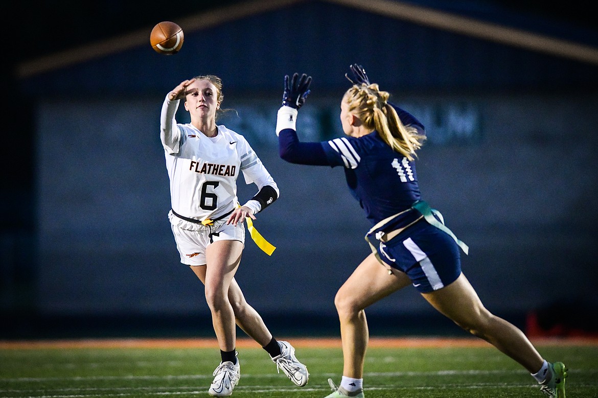 Flathead quarterback Harlie Roth (6) throws under pressure from Glacier's Emma Cooke (11) in the second half at Legends Stadium on Tuesday, Sept. 19. (Casey Kreider/Daily Inter Lake)