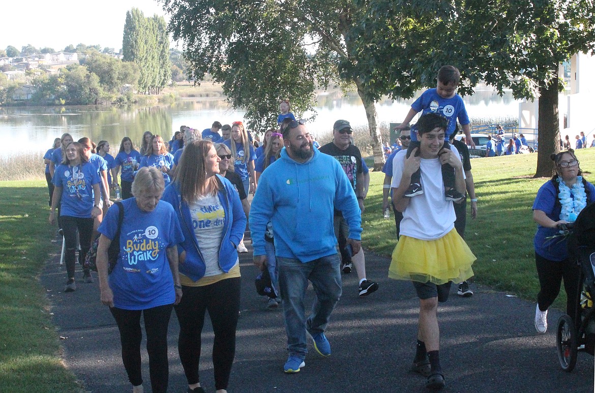 Teams of walkers set out from McCosh Park in Moses Lake on the 2022 Buddy Walk, hosted by the Down Syndrome Society of Grant County. This year’s event seeks to honor parents and caregivers who work to make life better for those with Down Syndrome.