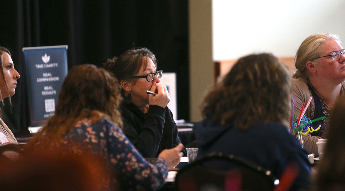 Daisy Bontrager listens to a presentation Tuesday morning during the True Charity Foundations Workshop at the Kroc Center.