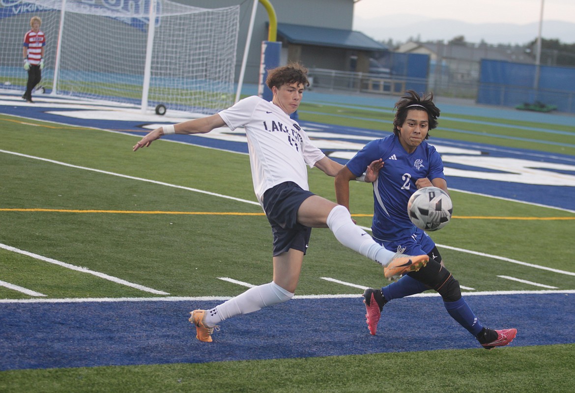 JASON ELLIOTT/Press
Lake City senior midfielder Valentyn Kuzyk plays the ball off his foot as Coeur d'Alene junior defender Chief Allan defends in Tuesday's match at Viking Field.