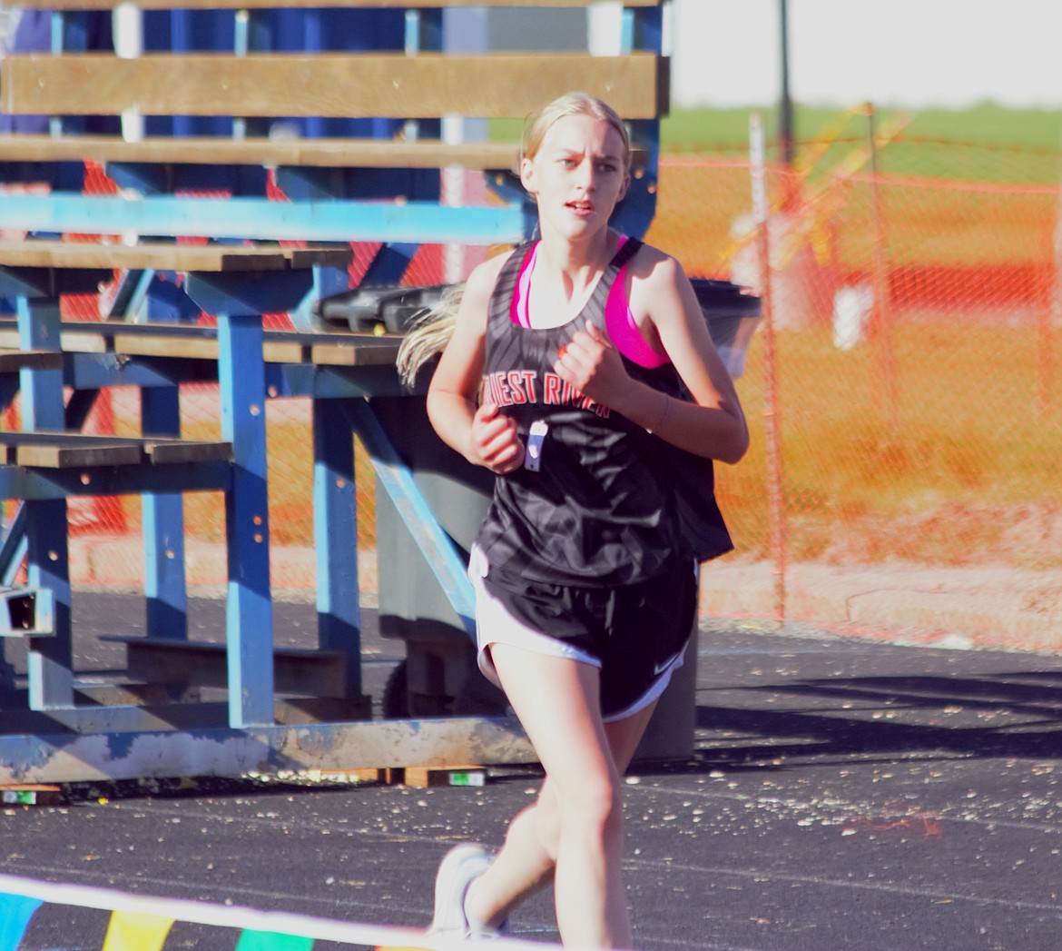 Priest River's Hailey Long speeds up near the finish line Saturday at the Bonners Ferry Invite. Long finished in eighth place with a 5k time of 26:03.