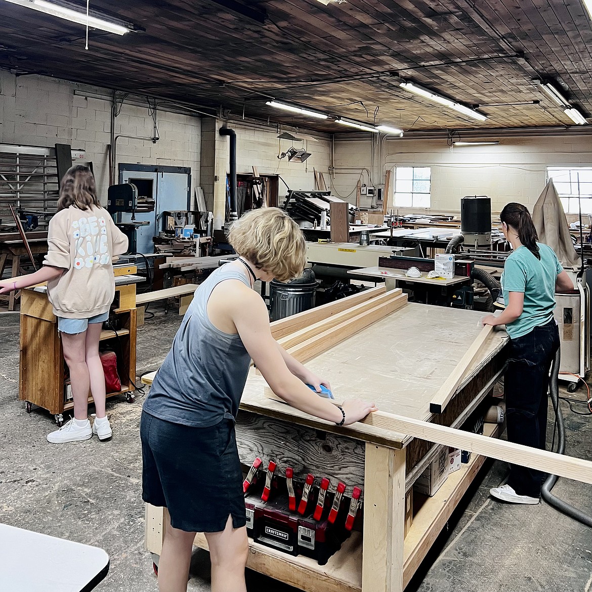 Nova High students build their own desks at a workshop before the start of school.