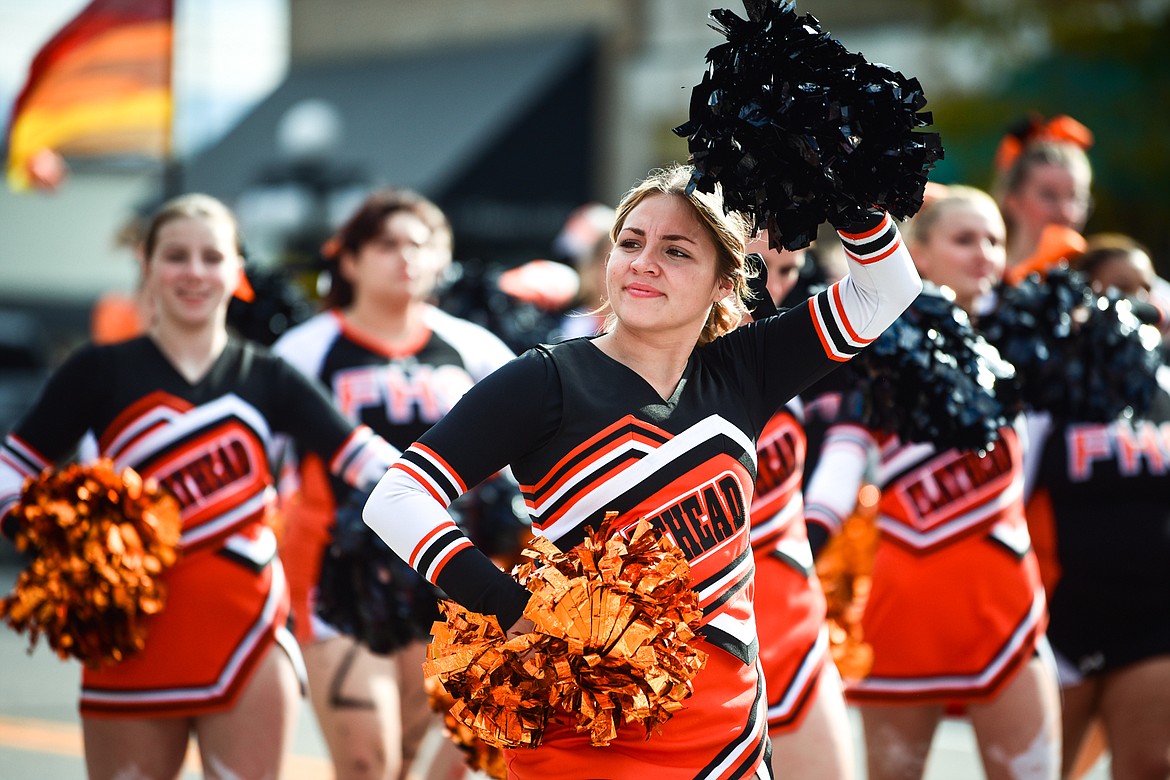 Cheerleaders lead the procession during the Flathead High School Homecoming Parade along Main Street in Kalispell on Wednesday, Sept. 20. (Casey Kreider/Daily Inter Lake)
