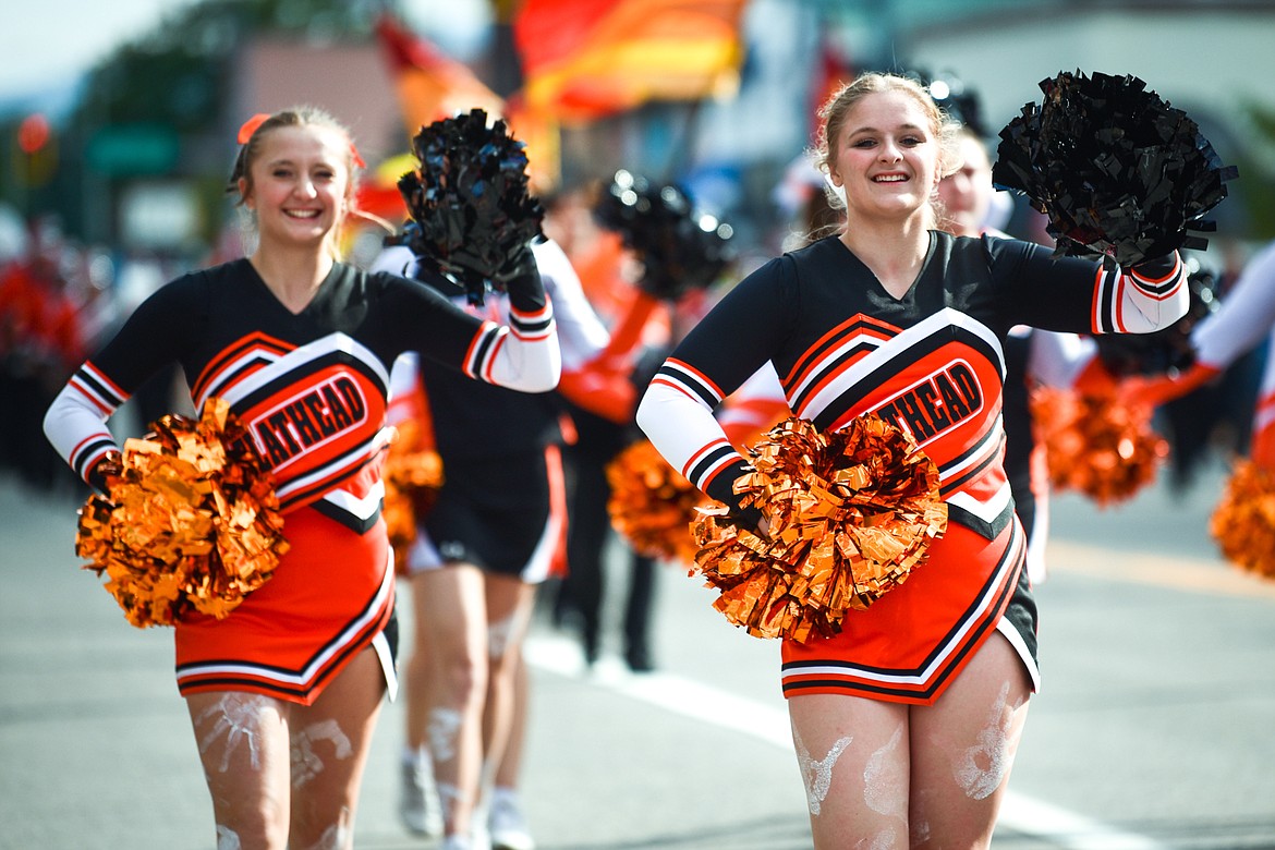 Cheerleaders lead the procession during the Flathead High School Homecoming Parade along Main Street in Kalispell on Wednesday, Sept. 20. (Casey Kreider/Daily Inter Lake)