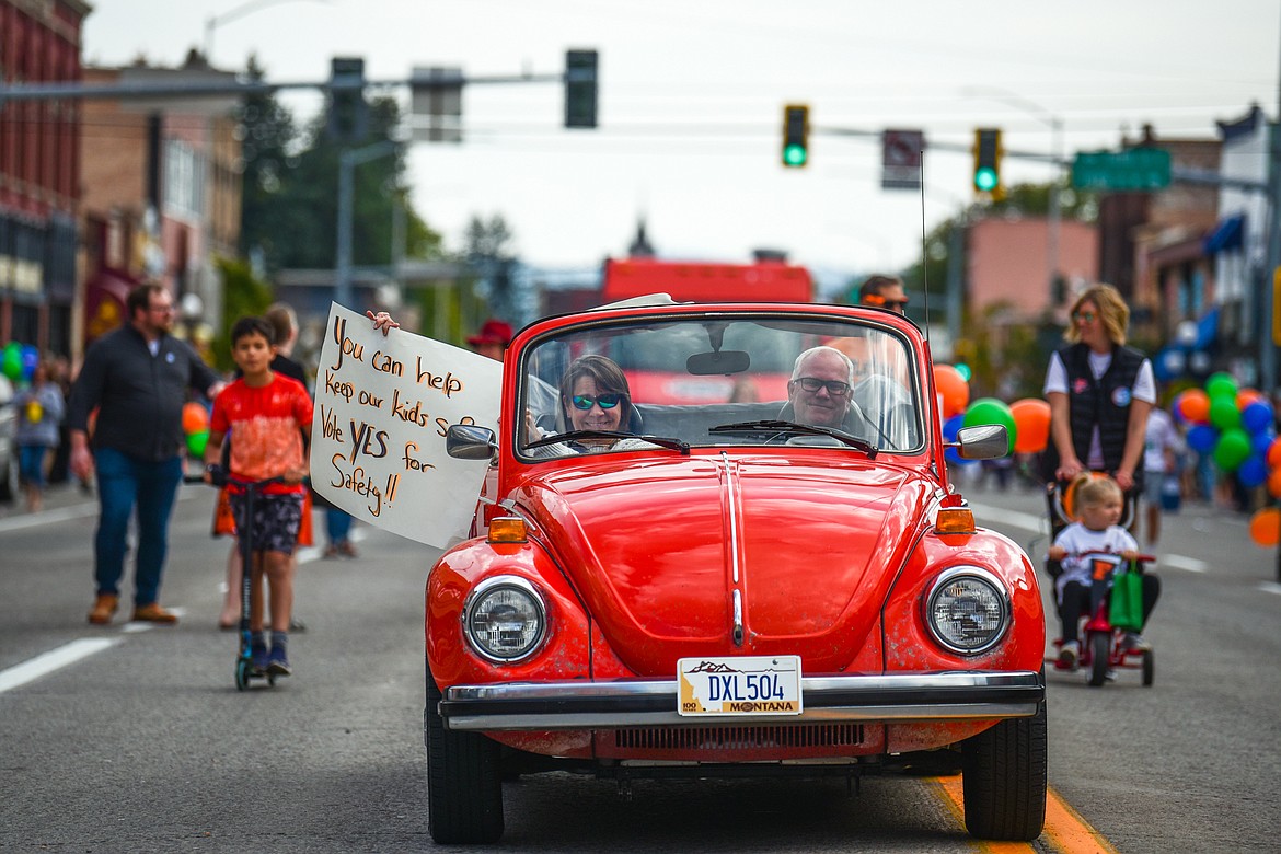 Vehicles, floats and members of the procession head down Main Street during the Flathead High School Homecoming Parade in Kalispell on Wednesday, Sept. 20. (Casey Kreider/Daily Inter Lake)