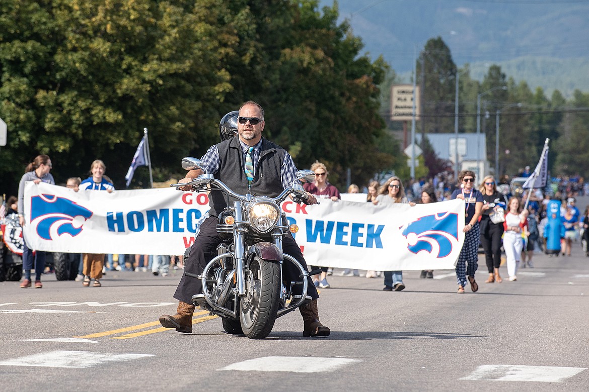 Columbia Falls Public Schools Superintendent Cory Dziowgo leads the Wildcats Homecoming Parade on Nucleus Avenue Wednesday, Sept. 20.
