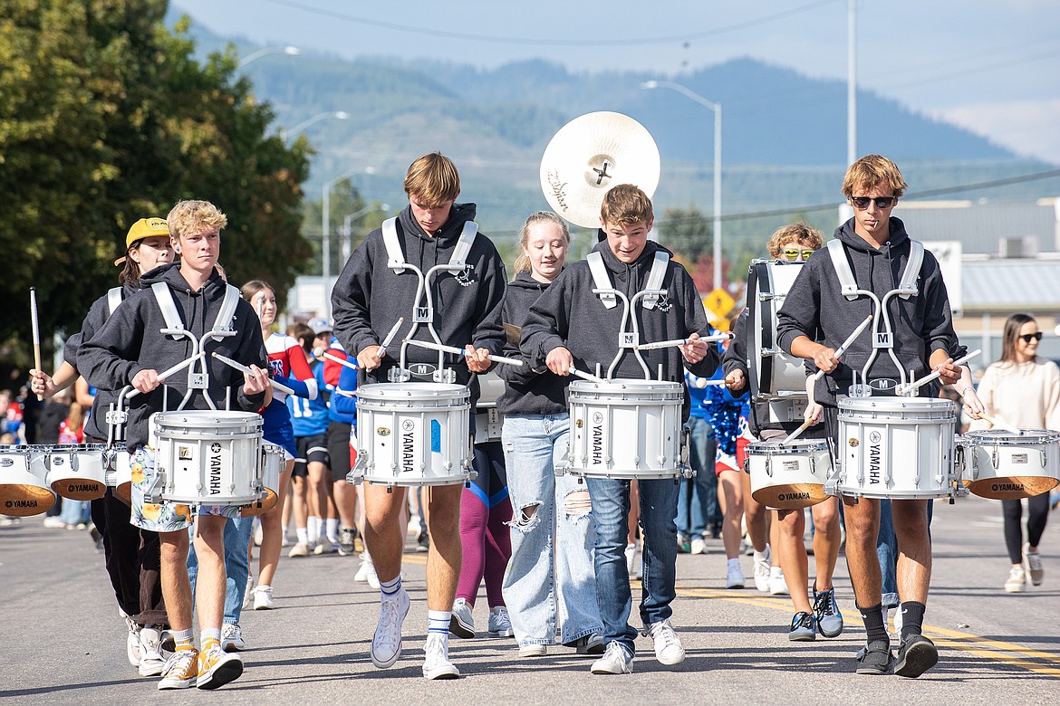 The Wildcats drum line marches down Nucleus Avenue for the Homecoming Parade.
