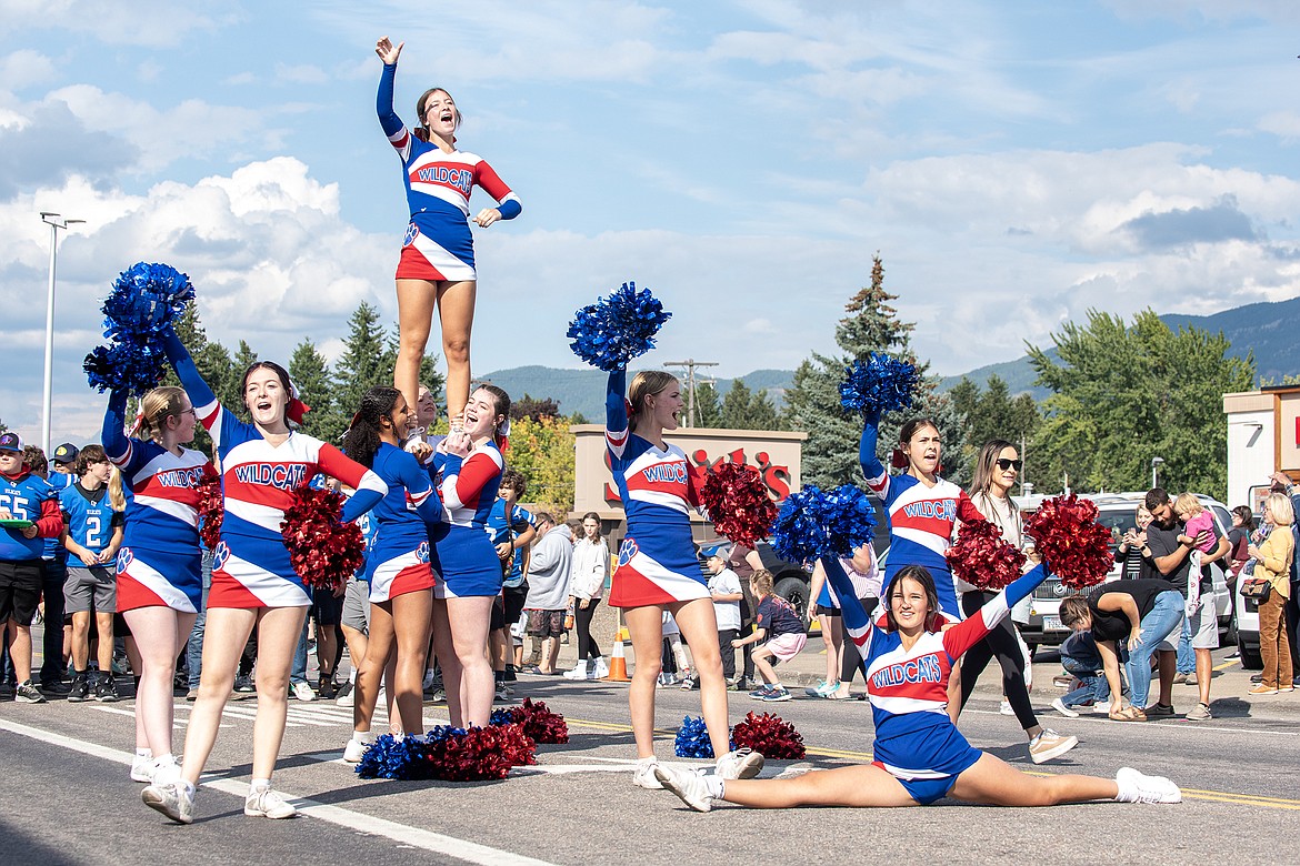 The Wildcats cheerleaders stop for a performance during the Homecoming Parade on Nucleus Avenue Wednesday.