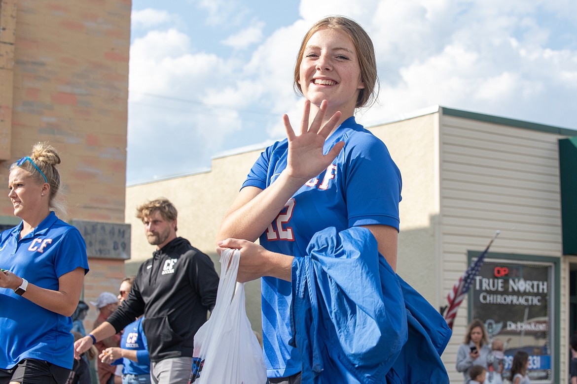 Wildcats soccer player Josie Harris hands out candy for the Homecoming Parade.
