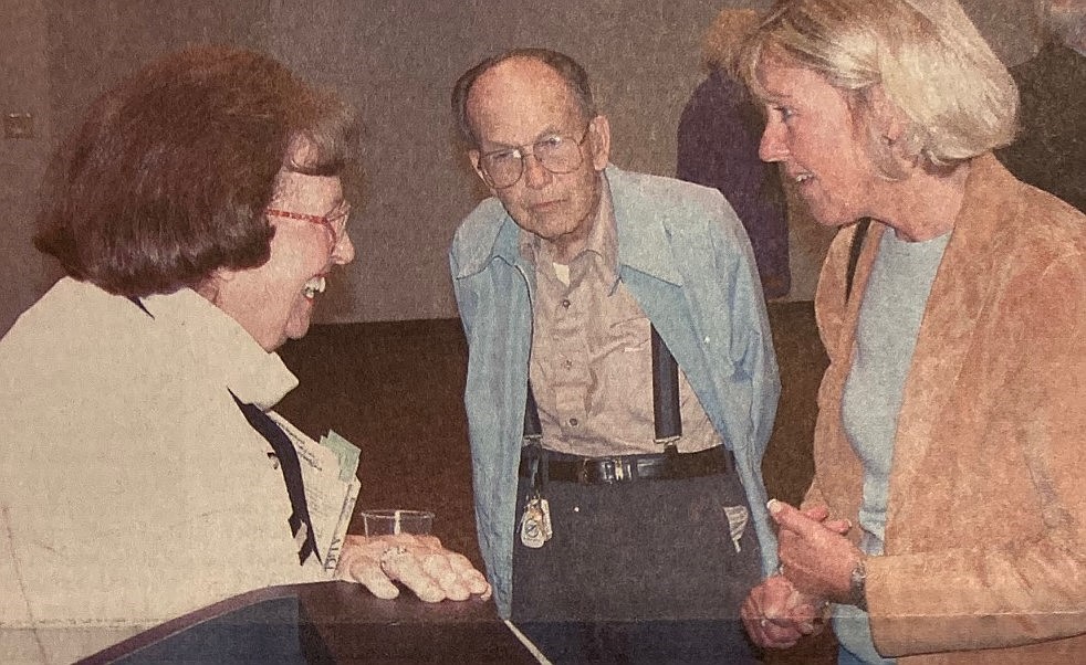 Bethine Church, left, talks with Art Manley and Cheryl Stransky at book promotion.