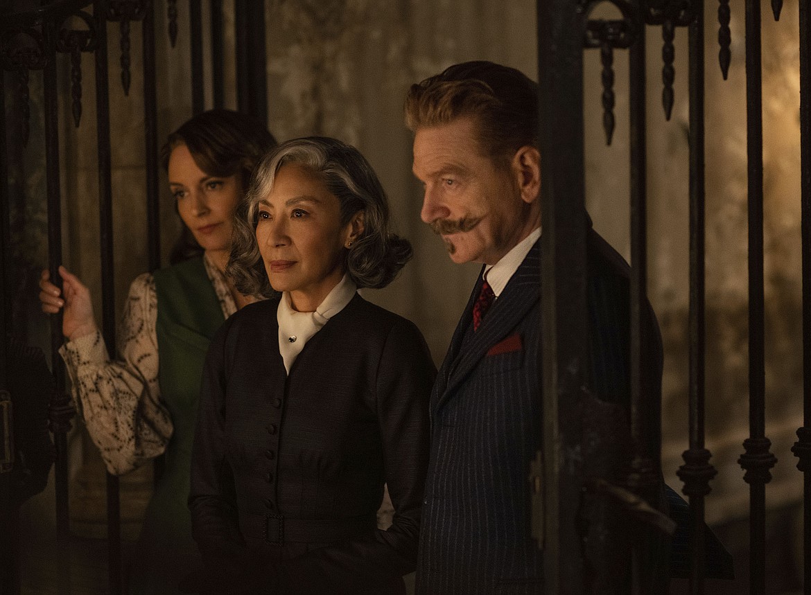 From left, Tina Fey as Ariadne Oliver, Michelle Yeoh as Mrs. Reynolds and Kenneth Branagh as Hercule Poirot in a scene from "A Haunting in Venice."