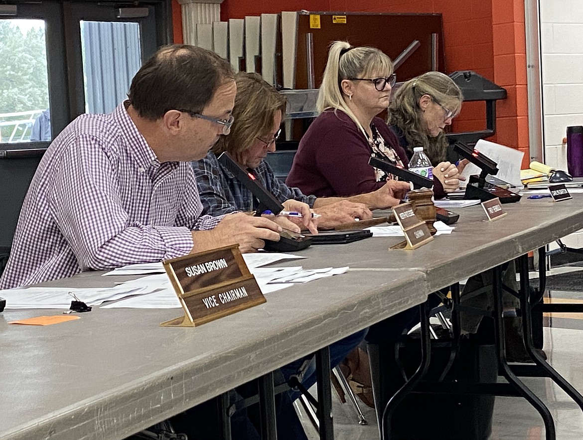 West Bonner County School Board trustee Troy Reinbold, second from left, is pictured at a past meeting. Reinbold opted against attending Wednesday's meeting, forcing board and district business to a halt.