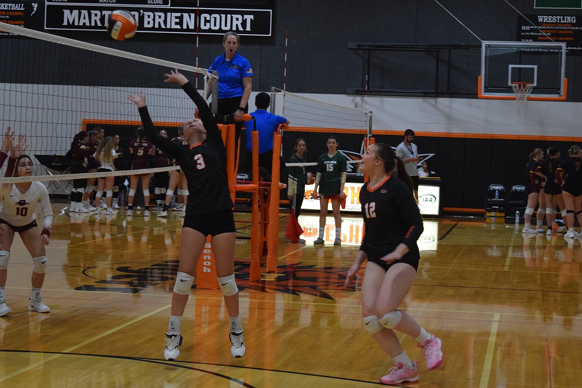 Ephrata junior Alixandria Helaas sets the ball over the net during Saturday’s Ephrata Varsity Volleyball Tournament.