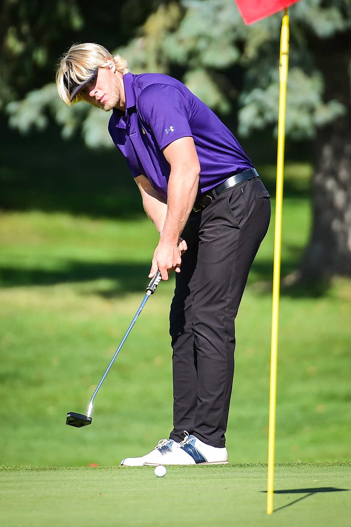 Polson's Christian Lund putts on the 16th green during the Western A Divisional tournament at Whitefish Lake Golf Club on Thursday, Sept. 21. (Casey Kreider/Daily Inter Lake)