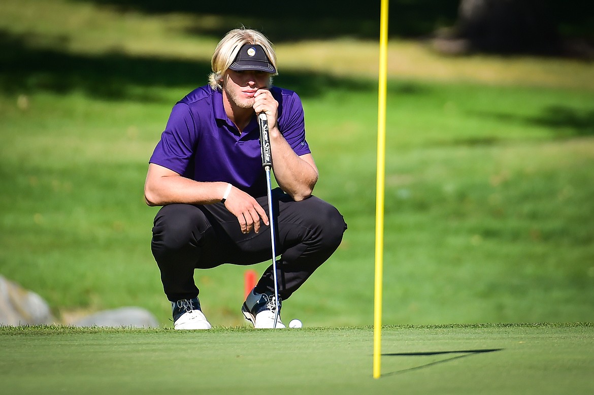 Polson's Christian Lund lines up a putt on the 16th green during the Western A Divisional tournament at Whitefish Lake Golf Club on Thursday, Sept. 21. (Casey Kreider/Daily Inter Lake)