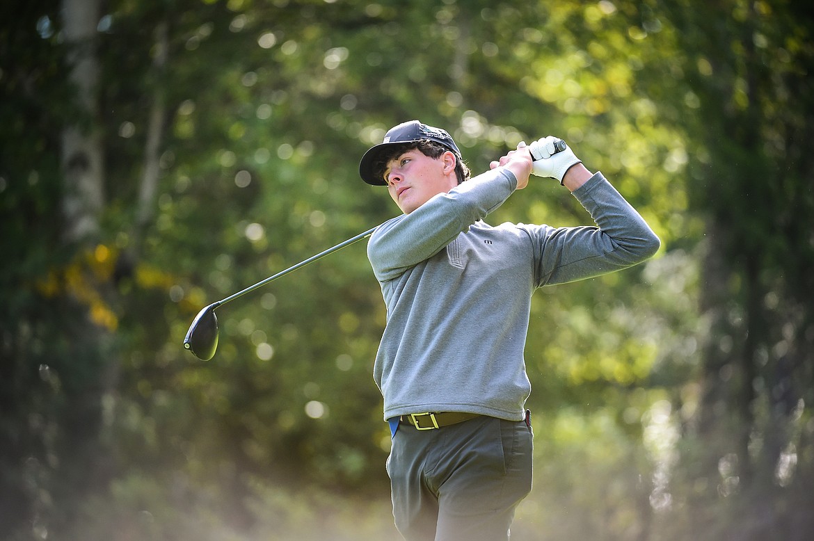 Columbia Falls' Winslow Peters watches his drive on the 12th tee during the Western A Divisional tournament at Whitefish Lake Golf Club on Thursday, Sept. 21. (Casey Kreider/Daily Inter Lake)