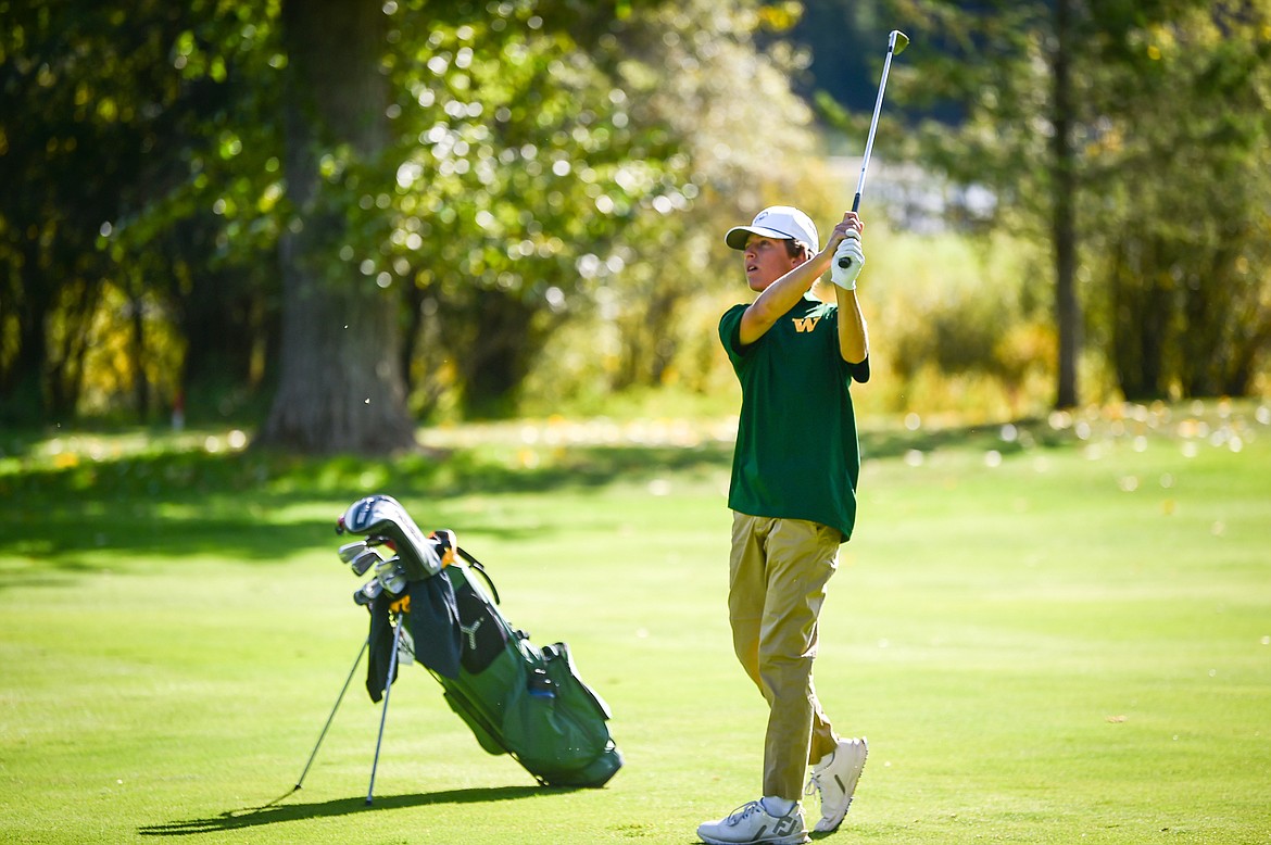 Whitefish's Riley Brown hits his approach on the 12th fairway during the Western A Divisional tournament at Whitefish Lake Golf Club on Thursday, Sept. 21. (Casey Kreider/Daily Inter Lake)