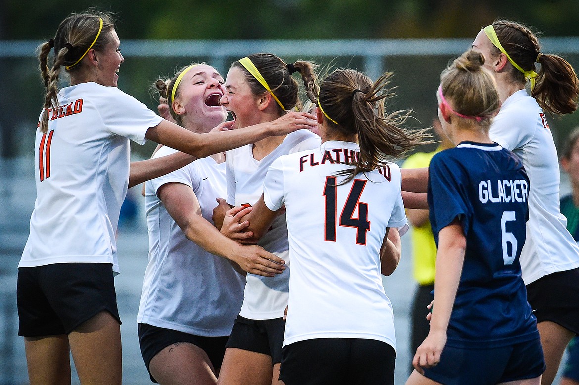 The Bravettes celebrate around Azalea Bailey (24) after her goal in the second half against Glacier at Legends Stadium on Thursday, Sept. 21. (Casey Kreider/Daily Inter Lake)