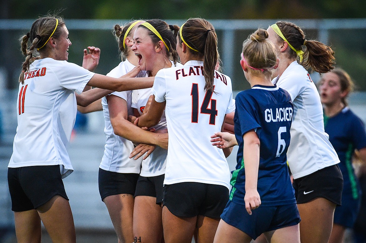 The Bravettes celebrate around Azalea Bailey (24) after her goal in the second half against Glacier at Legends Stadium on Thursday, Sept. 21. (Casey Kreider/Daily Inter Lake)