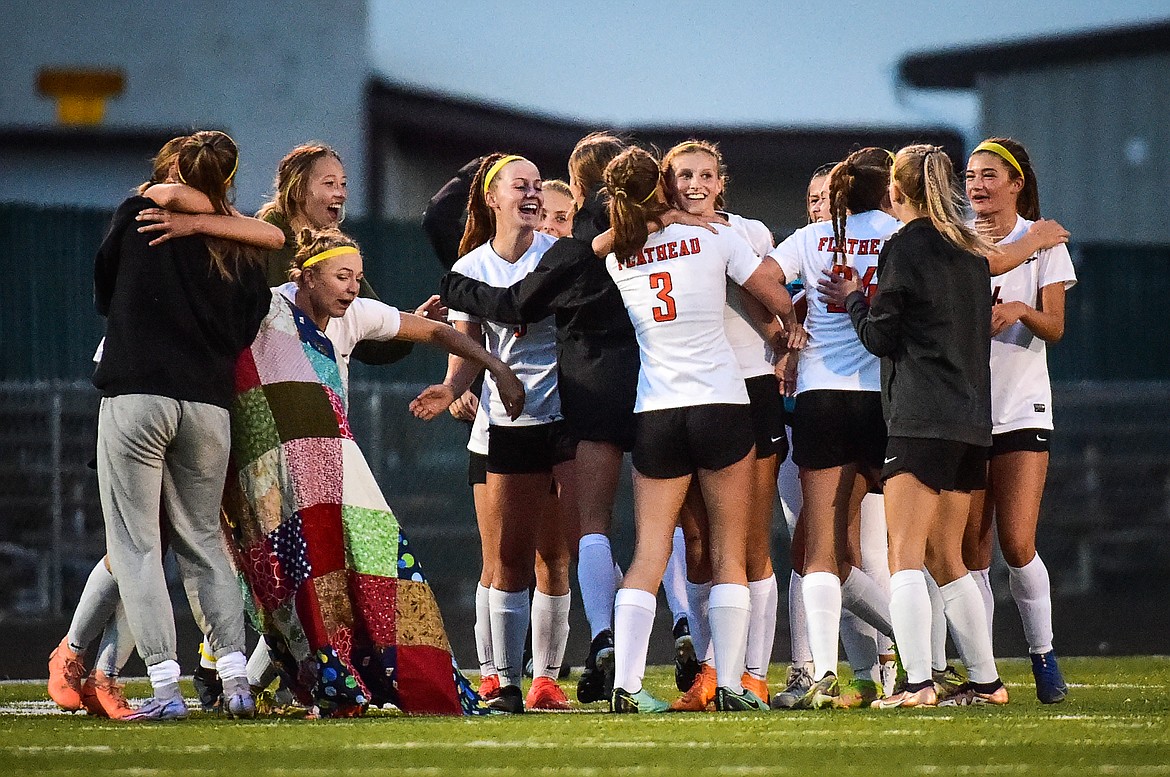 The Bravettes celebrate after their 3-2 victory over Glacier at Legends Stadium on Thursday, Sept. 21. (Casey Kreider/Daily Inter Lake)