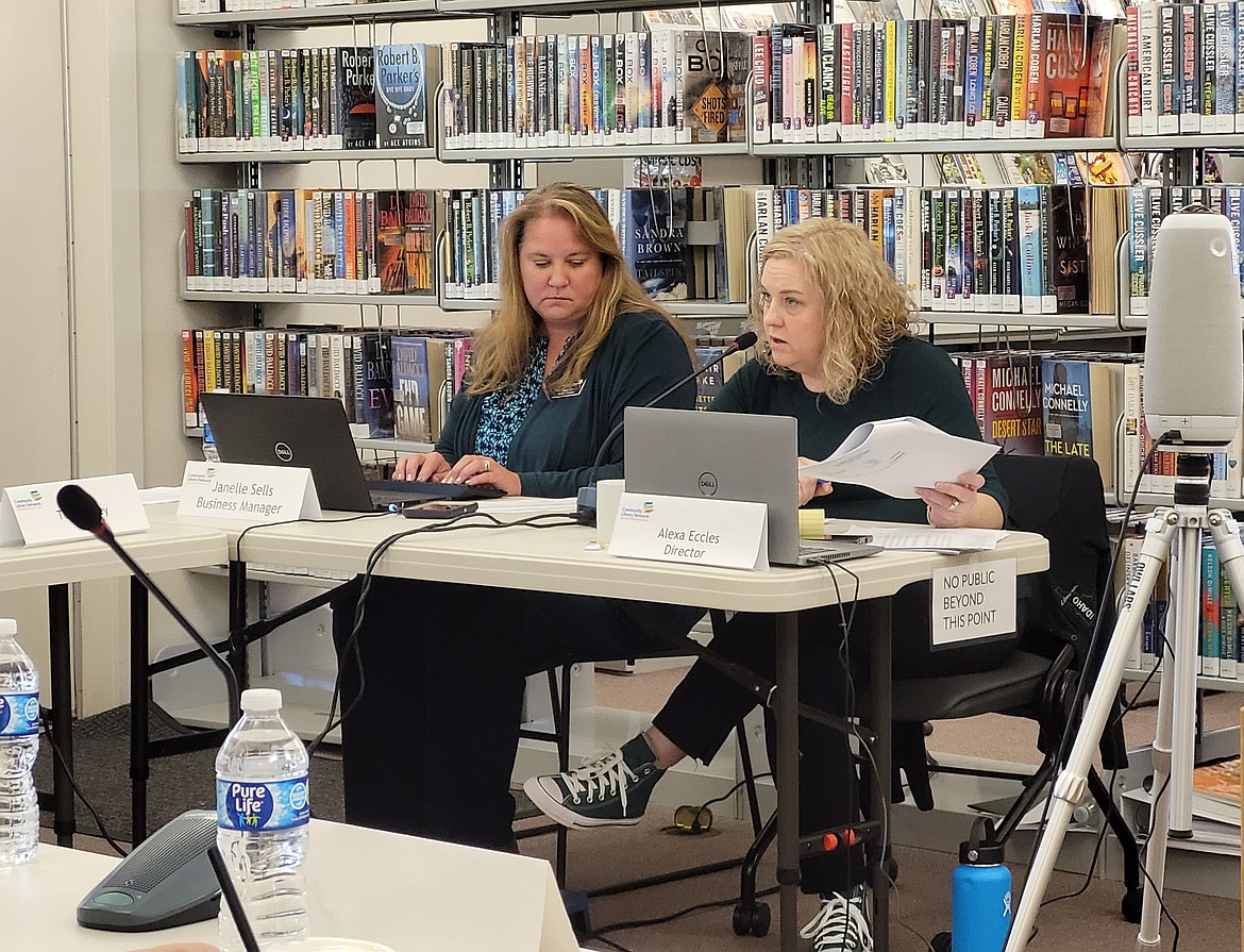 Community Library Network Director Alexa Eccles, right, answers a question Thursday morning during a meeting of the network's board at the Pinehurst Library. Also pictured: Community Library Network business manager Janelle Sells.