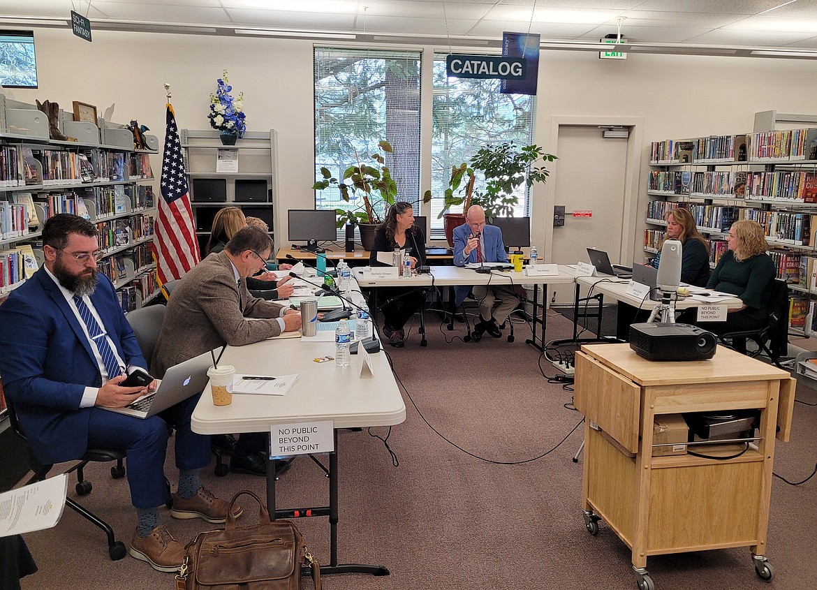 Trustees of the Community Library Network discuss insurance needs Thursday morning during a regular meeting at the Pinehurst Library.