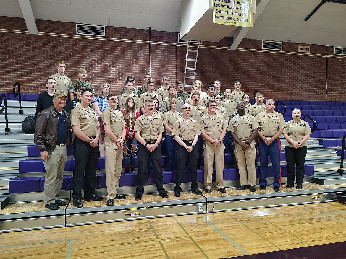 Members of  the USS Idaho crew take a group photo with Kellogg High School JROTC students.