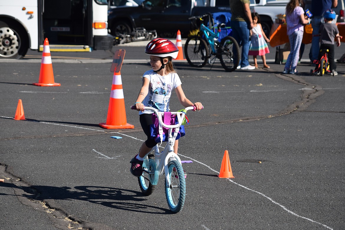 A rider pedals her way through the 2021 bike rodeo.