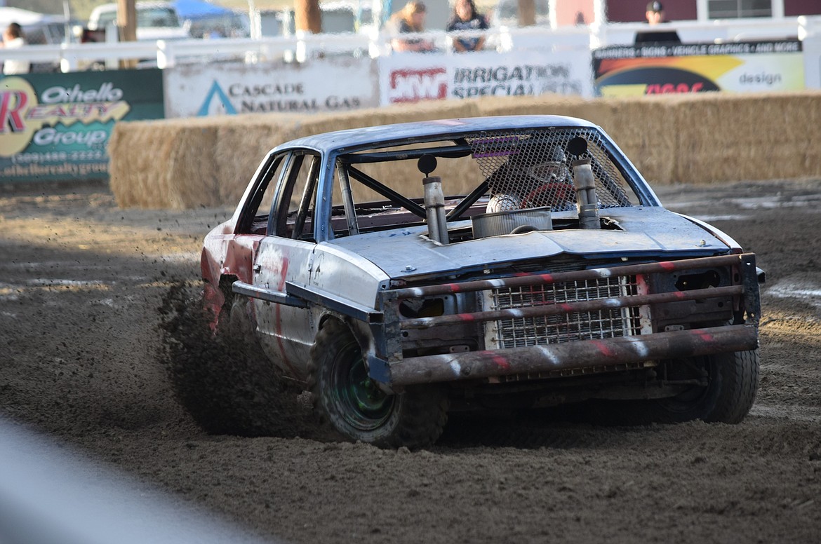 An Othello Demolition Derby competitor races around the rodeo arena as fast as he can to get the best time in the time trials a the Sept. 13 competition.