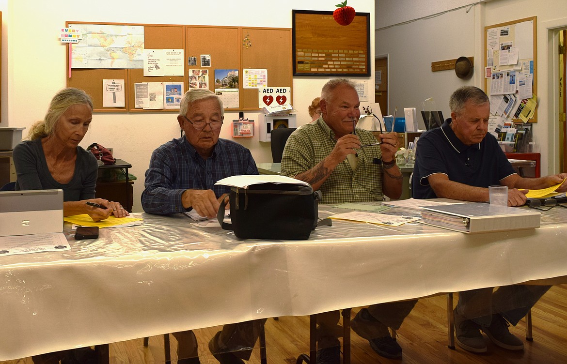 Soap Lake City Council members Karen Woodhouse, Steve Wellein, Allen DuPuy and Fred Slipper prepare for the Sept. 6 regular council meeting, during which Wellein, DuPuy and Woodhouse voted against a motion to adopt 9 a.m. to 4 p.m. public hours for Soap Lake City Hall.