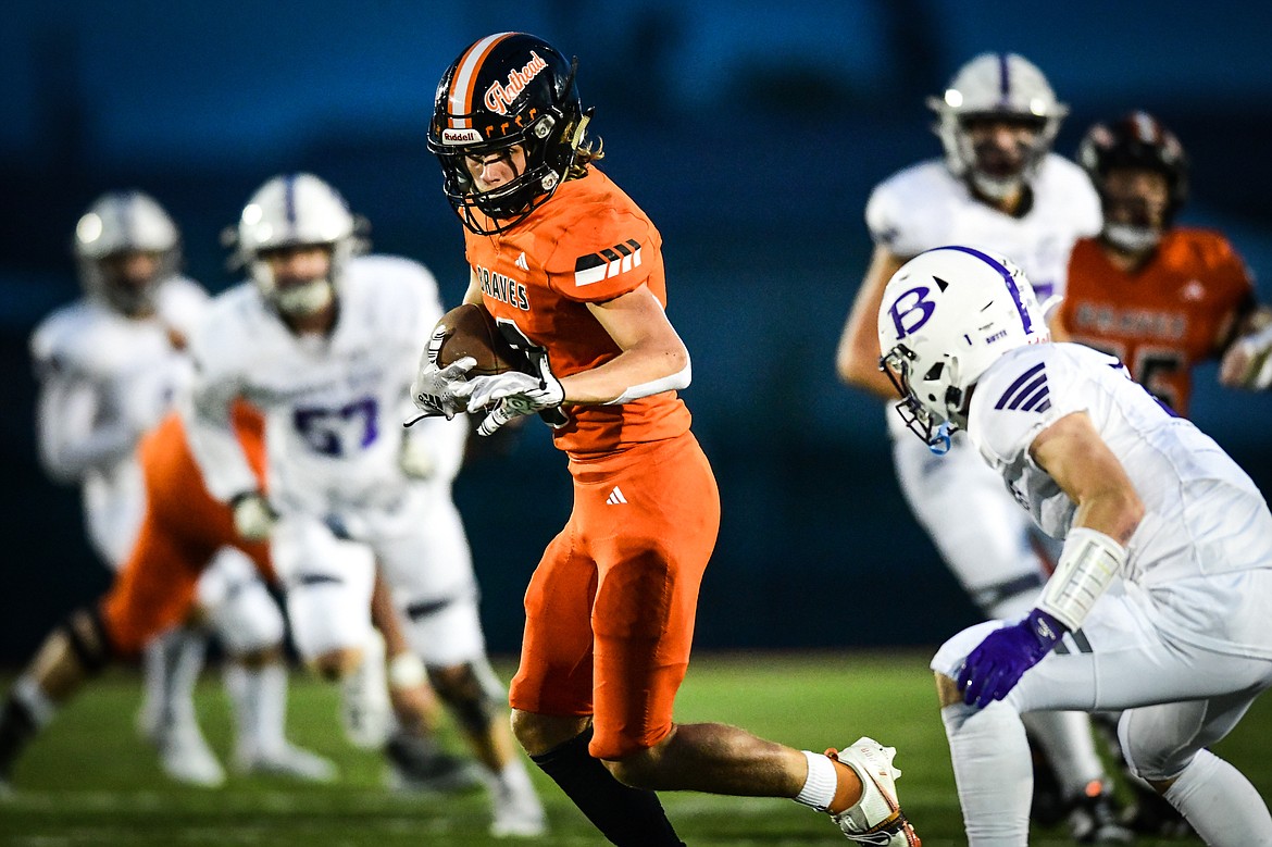 Flathead wide receiver Ben Bliven (2) picks up yardage on a reception in the third quarter against Butte at Legends Stadium on Friday, Sept. 22. (Casey Kreider/Daily Inter Lake)