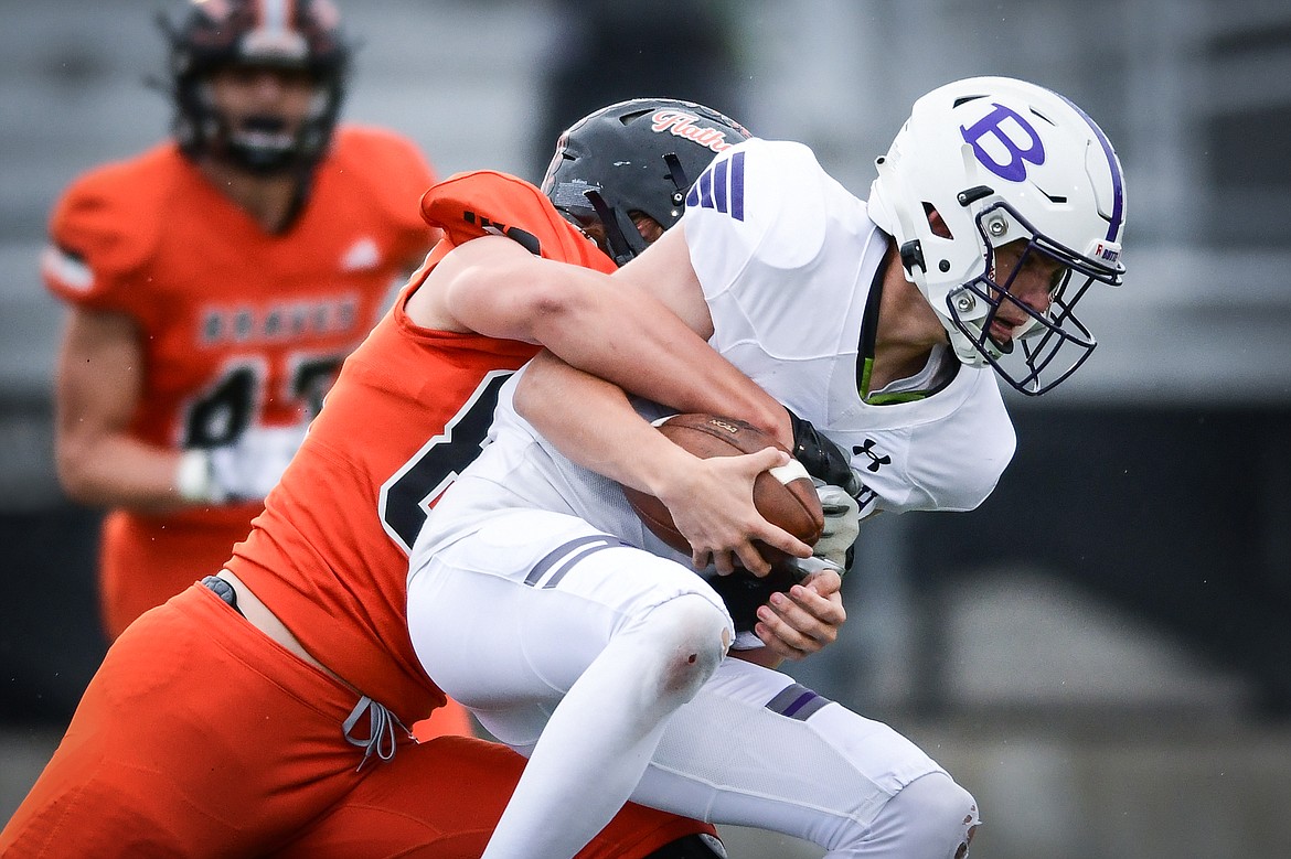 Flathead defensive lineman Gabe Sims (84) sacks Butte quarterback Bo Demarais in the first quarter at Legends Stadium on Friday, Sept. 22. (Casey Kreider/Daily Inter Lake)