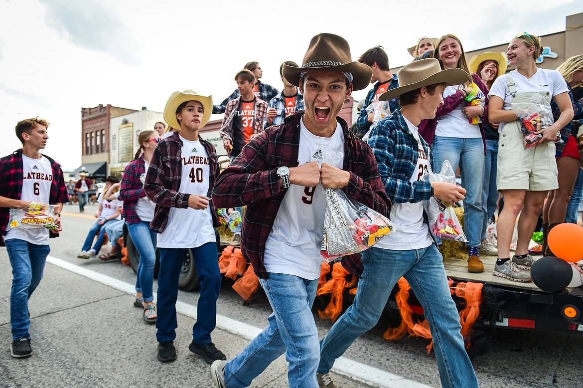 Members of the Flathead boys and girls soccer teams hand out candy during the homecoming parade along Main Street in Kalispell on Wednesday, Sept. 20. (Casey Kreider/Daily Inter Lake)