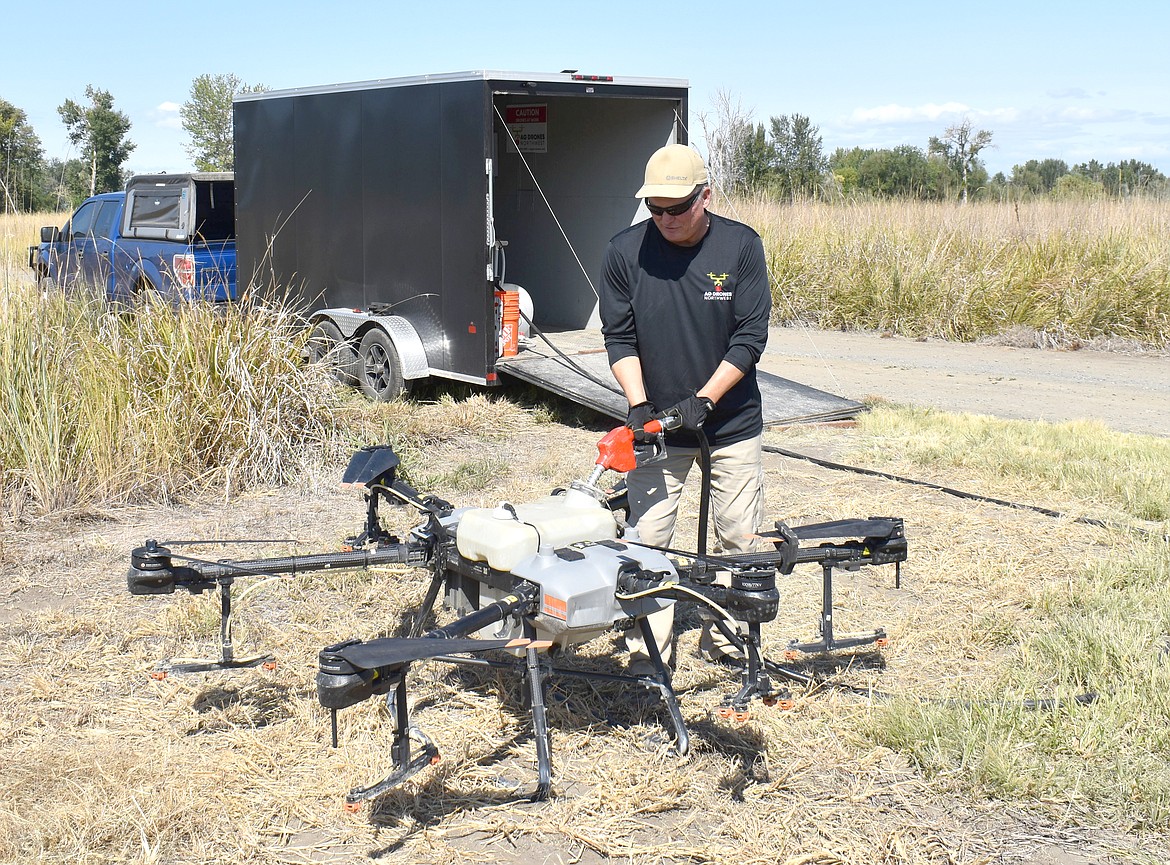 Bill Kuper, owner of Ag Drones Northwest, demonstrates the nozzles on his sprayer drone. The device has 16 nozzles that can be programmed to turn on and off in flight, to make sure the liquid is as precisely placed as possible.