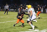 Burns, Trojans run over Hawks