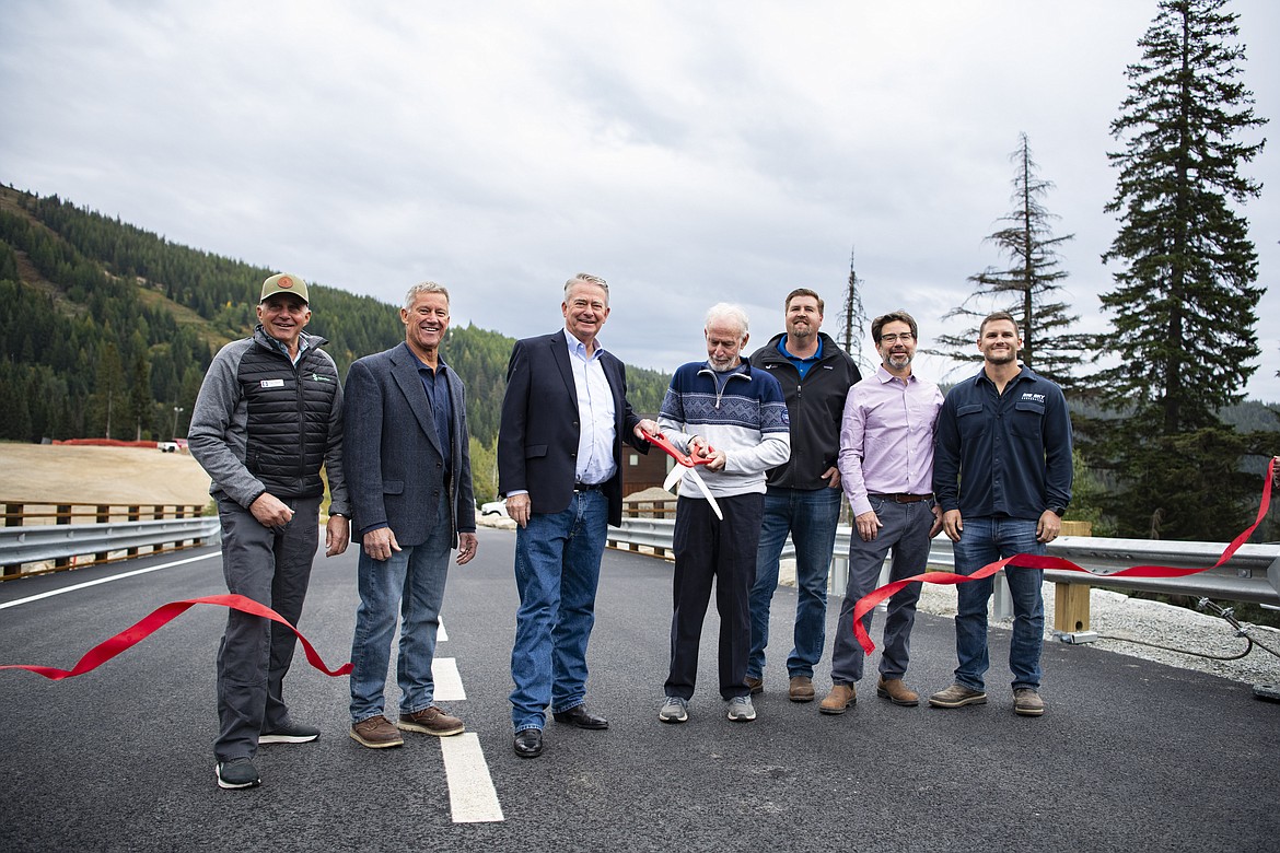 Idaho Governor Brad Little is joined by local officials as they celebrate the opening of the Northwest Passage Bridge, the first project to be completed under his Leading Idaho Local Bridges program. Pictured are Tom Chasse, Schweitzer; Rep. Mark Sauter, District 1A; Gov. Brad Little; Mel Bailey, Independent Highway District, Ryan Luttmann, Century West; and Shawn Metts, HMM Engineering; and Brian Dagon, Big Sky Corporation.