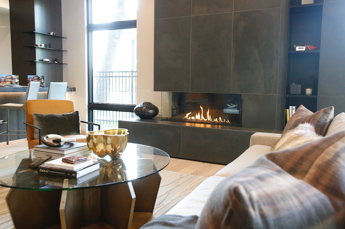 A custom fireplace crackles in the sitting room of The Sparrow.