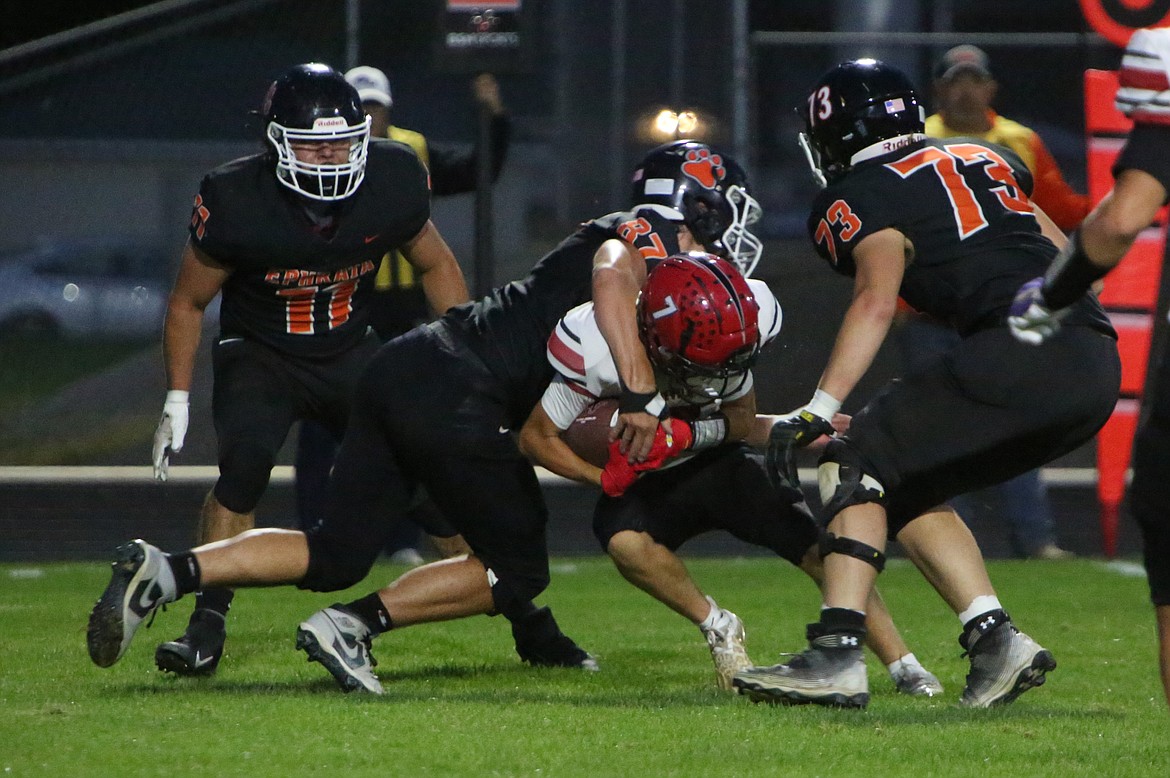 Ephrata senior Jaxon Elliott (87) tackles an East Valley player in the first half of Friday’s win.