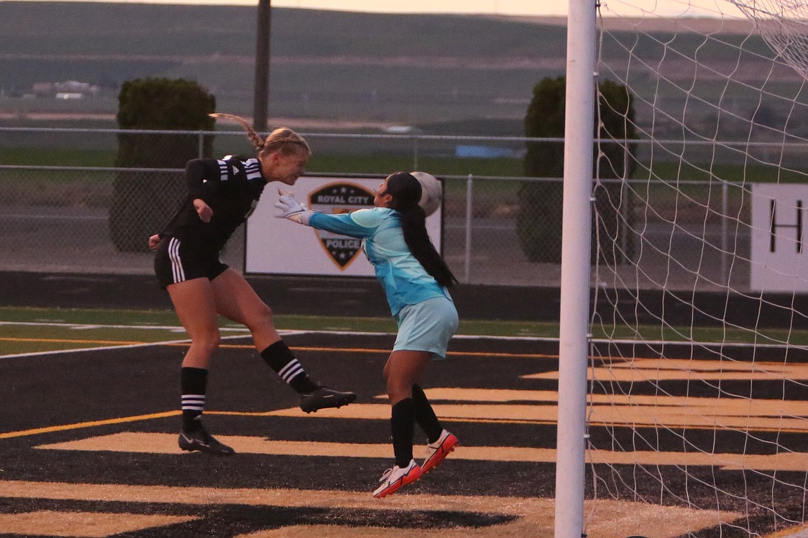 Royal junior Audrey Bergeson, in black, uses her head to score a goal in the 44th minute of Thursday’s 3-0 win over Wahluke.