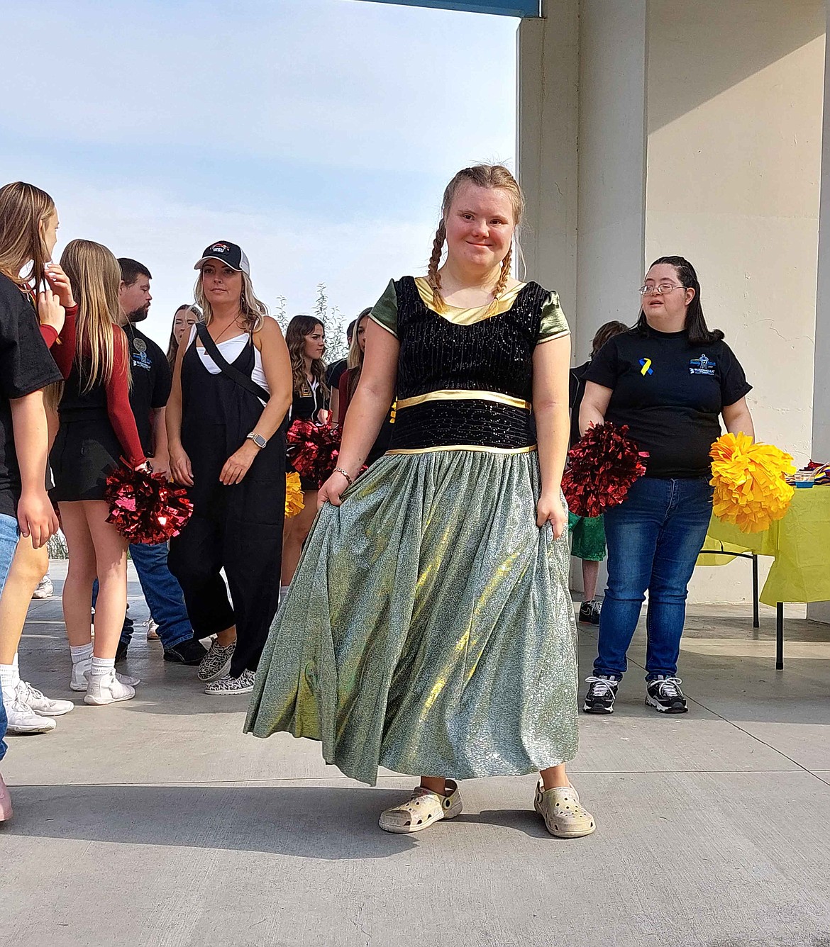 Twenty-year-old Benita Ketola shows off her Princess Anna dress at the Buddy Walk Saturday at McCosh Park. Benita chooses a different princess every year and her mom Denise Ketola makes her a dress to match, Denise said.